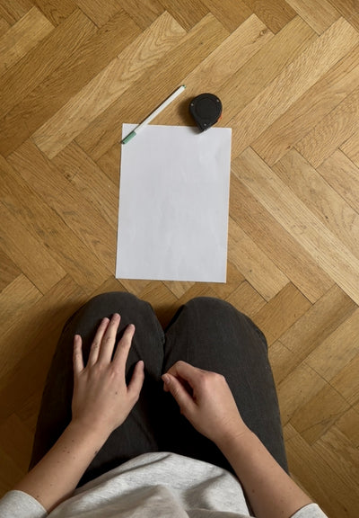 Place paper on floor